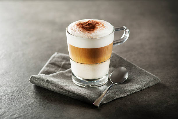 Latte macchiato coffee Glass of hot Latte macchiato coffee close up. cappuccino stock pictures, royalty-free photos & images
