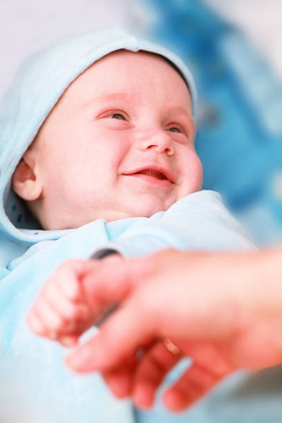 Laughing baby boy stock photo