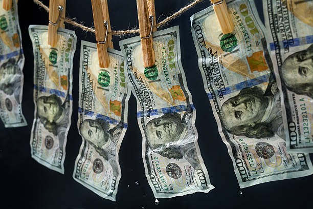 Laundered dollars hanging on a rope stock photo