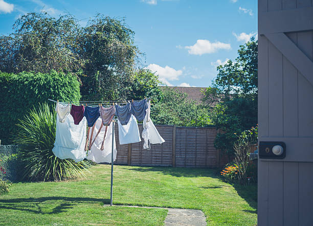 Laundry drying in garden stock photo