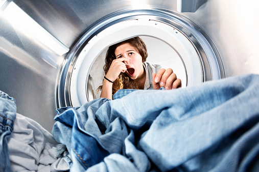 https://www.istockphoto.com/photo/laundry-left-in-clothes-dryer-stinks-unhappy-woman-holds-nose-gm516654225-48960134?utm_source=pixabay&utm_medium=affiliate&utm_campaign=SRP_image_sponsored&referrer_url=http%3A%2F%2Fpixabay.com%2Fimages%2Fsearch%2Fdirty%2520washer%2F&utm_term=dirty%20washer