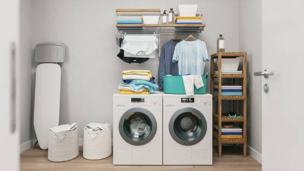 Laundry Room Laundry room with clothes, washing and drying machine. utility room photos stock pictures, royalty-free photos & images