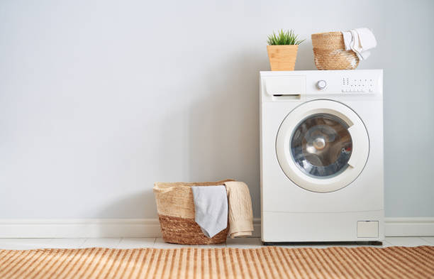 laundry room with a washing machine stock photo