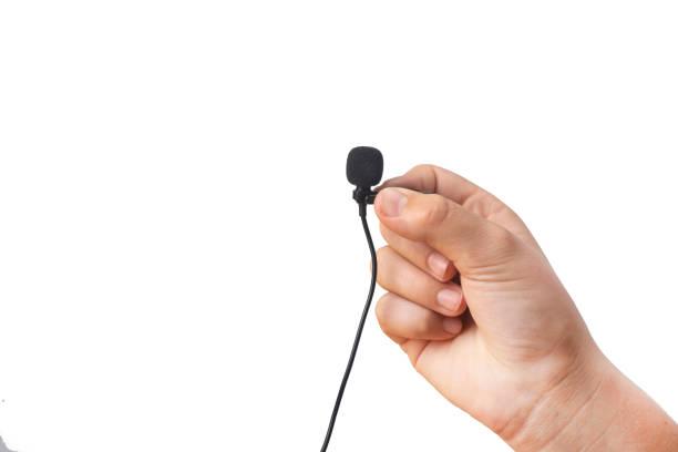 Lavalier microphone in hand on a white background. stock photo