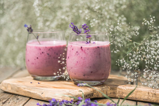 Lavender smoothie with coconut milk, blueberry.  Vegan beverage stock photo