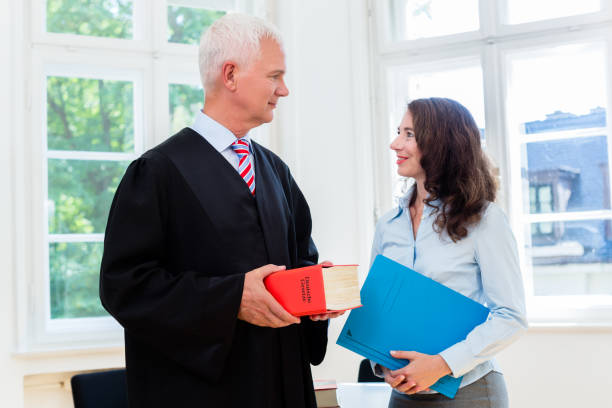 Lawyer and paralegal in their law office stock photo