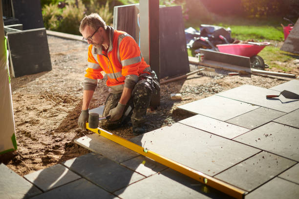 laying a patio in slate laying a patio in slate bricklayer stock pictures, royalty-free photos & images