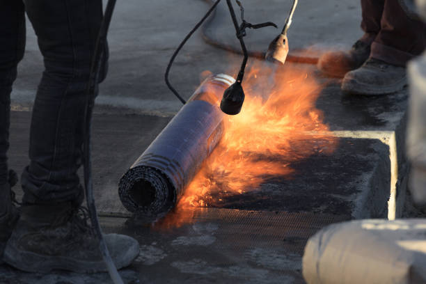 Laying of roofing felt from the roll with a flame from the burner close-up. Laying of roofing felt from the roll with a flame from the burner close-up. tar stock pictures, royalty-free photos & images