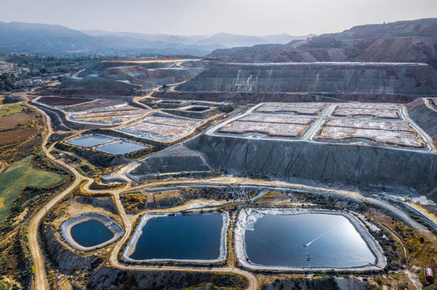 Leaching heaps and storage reservoirs at copper ore processing plant. Skouriotissa, Cyprus stock photo