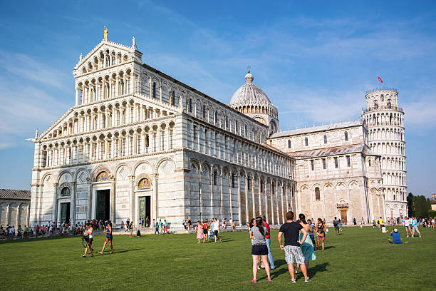 Leaning tower of Pisa with more people, Italy stock photo