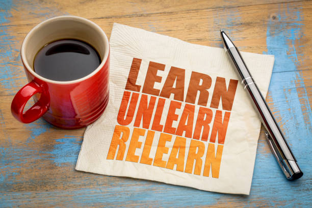 learn, unlearn, relearn concept on napkin stock photo