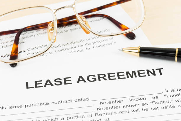 Lease agreement document with glasses and pen stock photo