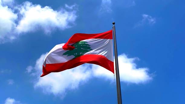 Lebanon flag in the wind The Lebanon flag in the sky with wind and clouds Lebanon Flag stock pictures, royalty-free photos & images