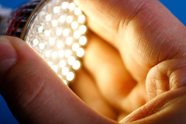 Led Light in hand  led light stock pictures, royalty-free photos & images