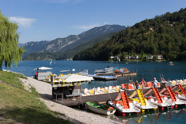 Ledro Lake - Colorful pedal boats, Trentino-Alto Adige stock photo