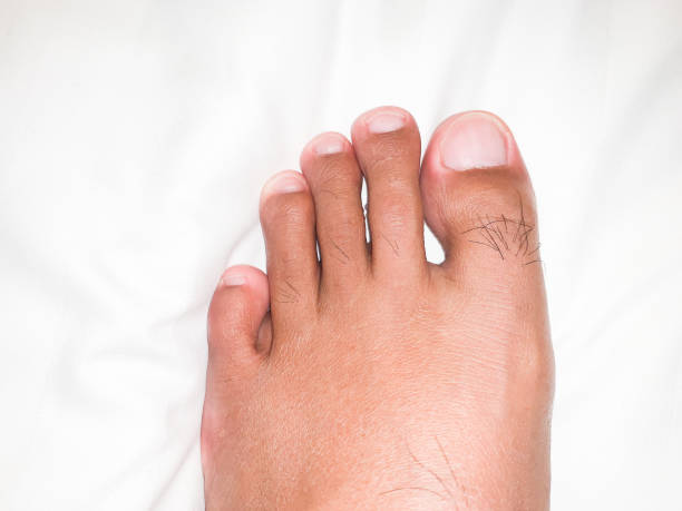 A Left Foot A left foot of a 28-year-old Asian adult male who is brownish yellow man pedicure stock pictures, royalty-free photos & images