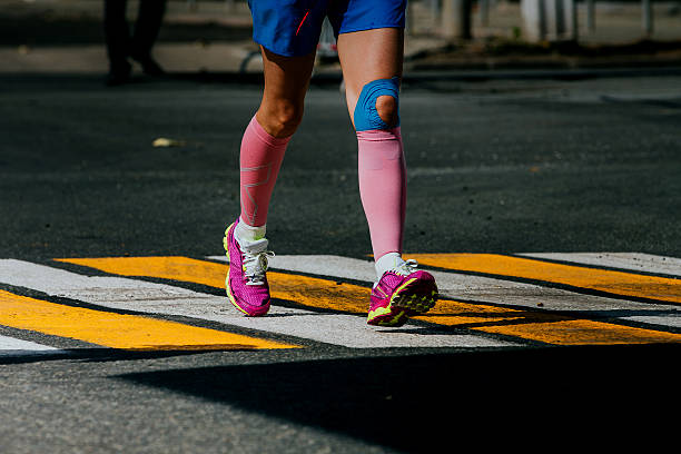 legs women athletes in compression socks stock photo