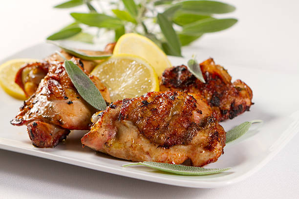 Lemon and Sage Grilled Chicken  chicken thigh meat stock pictures, royalty-free photos & images