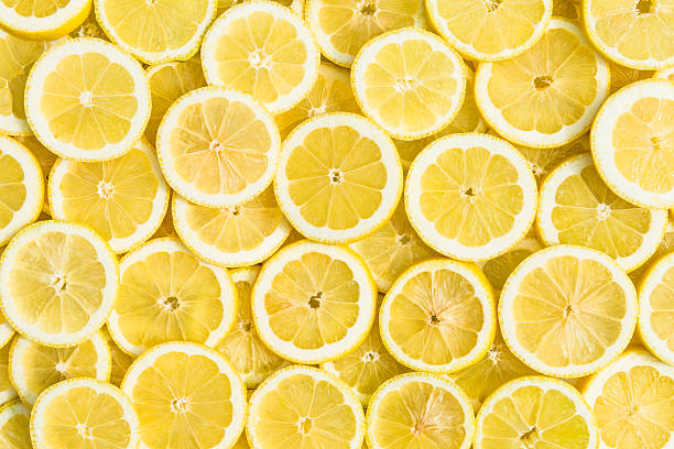 lemon background lemon slices full frame sour taste stock pictures, royalty-free photos & images