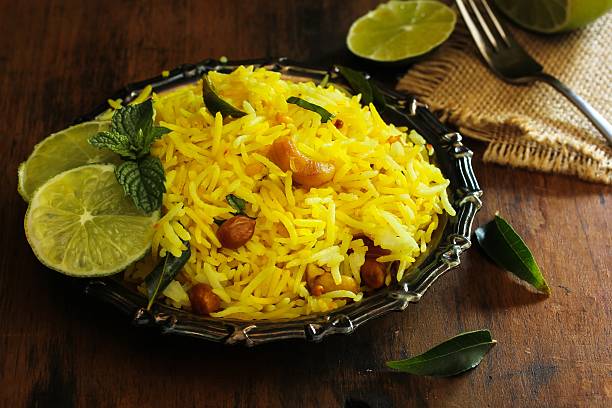 Lemon rice / South Indian Rice dish with lemon stock photo