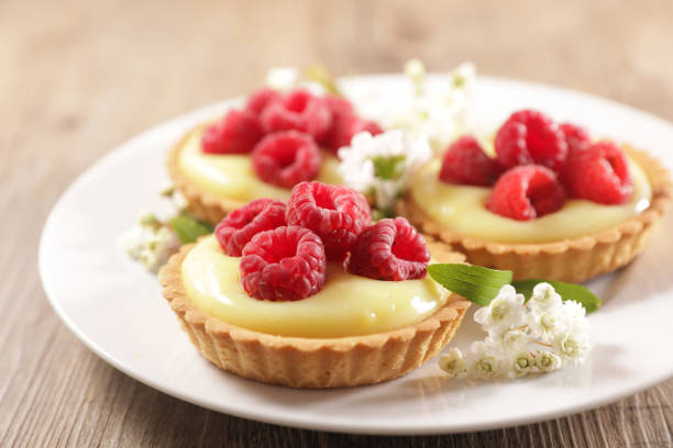 lemon tart and raspberries fruits stock photo