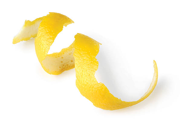 Lemon twist Lemon twist on white background. twisted stock pictures, royalty-free photos & images