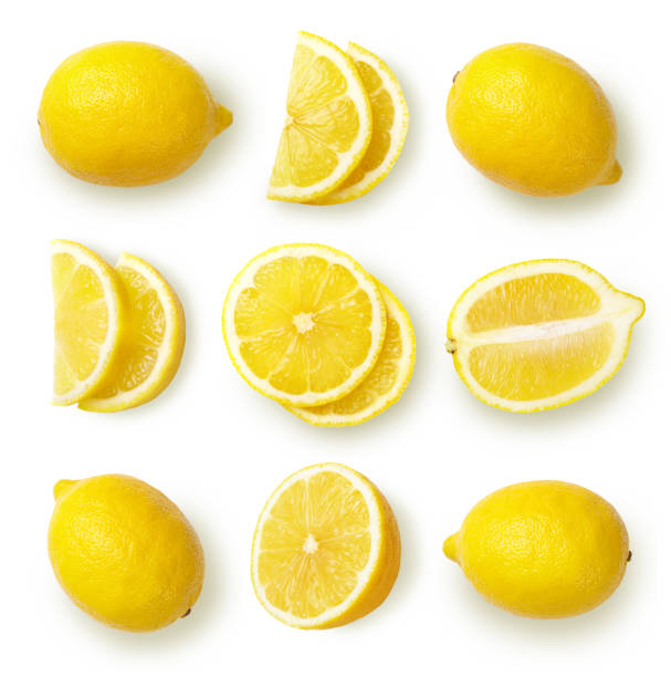 Lemons isolated on white background. Composition with whole and sliced lemons, cut out. Top view. chopped food photos stock pictures, royalty-free photos & images