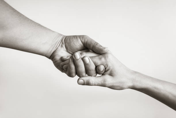 Lending a helping hand. Solidarity, compassion, and charity. a helping hand stock pictures, royalty-free photos & images