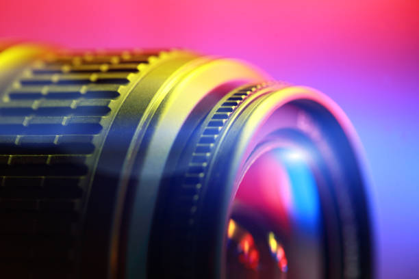 Lens, close-up Lens, close-up. Abstract color illuminated. studio shot photos stock pictures, royalty-free photos & images