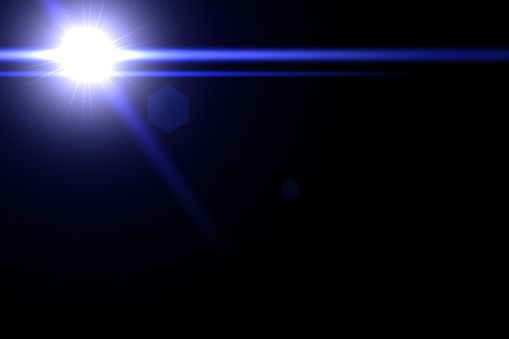 flare for photography and anamorphic lens flare. Blue Lens flare and light beam on dark background. Lens Flare on black background. lens effects for overlay designs or screen blending mode