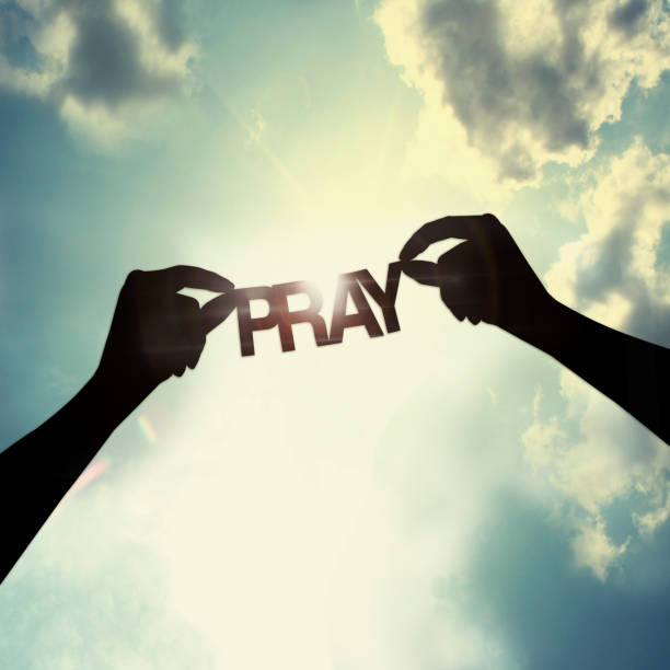 let pray together stock photo