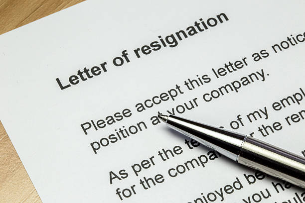 Letter of resignation silver pen Letter of resignation closeup with silver pen endurance stock pictures, royalty-free photos & images