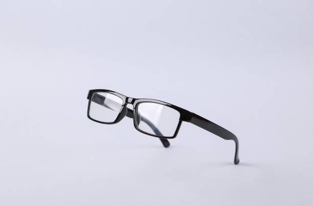 Levitating eye glasses on gray background stock photo