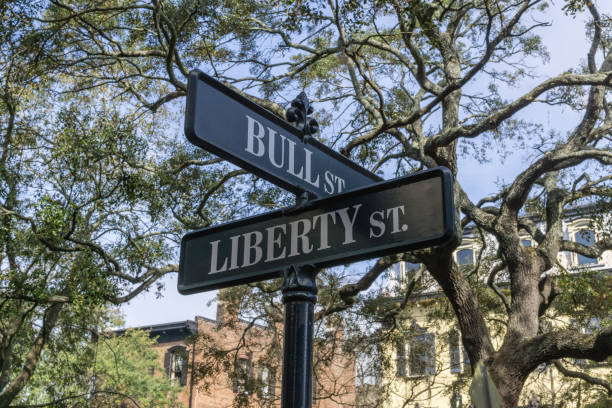 Liberty and Bull Street, Savannah, Georgia Corner of Liberty and Bull Street in the heart of the historic Savannah downtown. historic district stock pictures, royalty-free photos & images