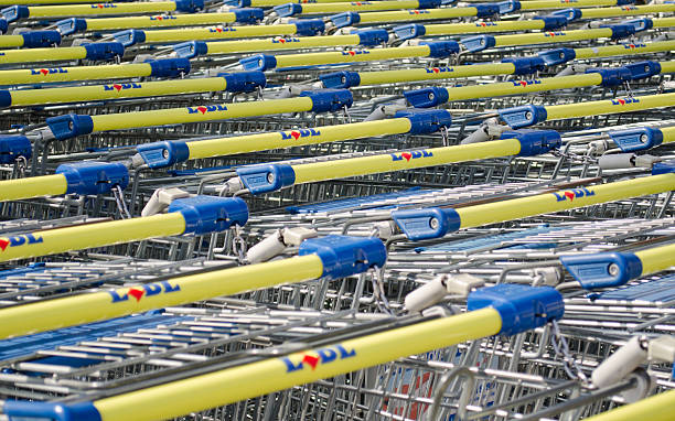 Lidl Shopping carts - Germany "Gera, Germany - September 2, 2012:  Lidl logo on the grip of their shopping carts.Lidl is a worldwide operating discount supermarket chain. Lidl operates about 7200 stores worldwide." lidl stock pictures, royalty-free photos & images
