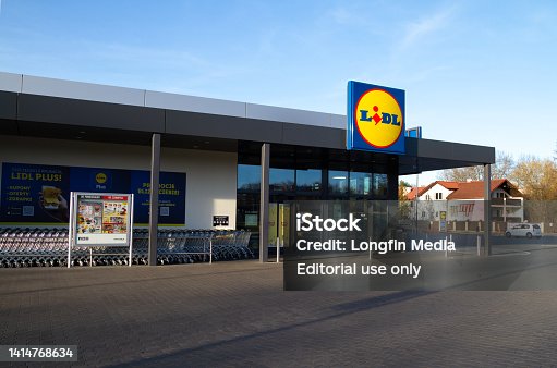 Lidl store entrance with logo signboard.