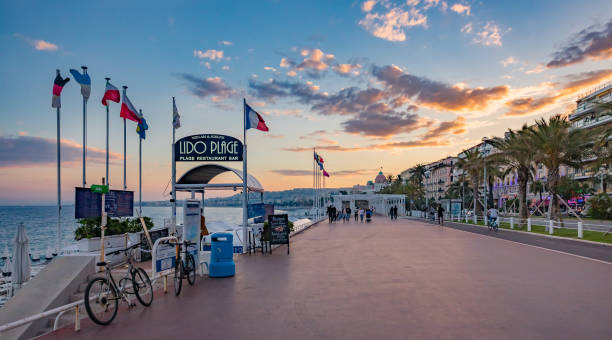 Lido Beach and Mediterranean Sea  and famous hotel Negresco in Nice France stock photo
