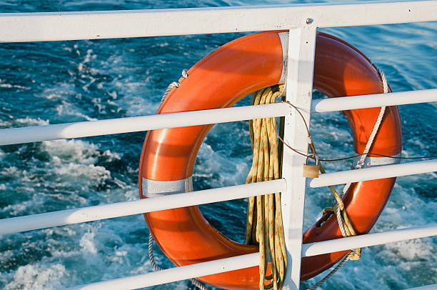 Life Buoy Connected to Ship Railing stock photo