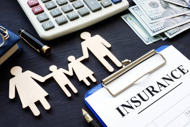Life insurance. Policy and figures of family.  life insurance stock pictures, royalty-free photos & images