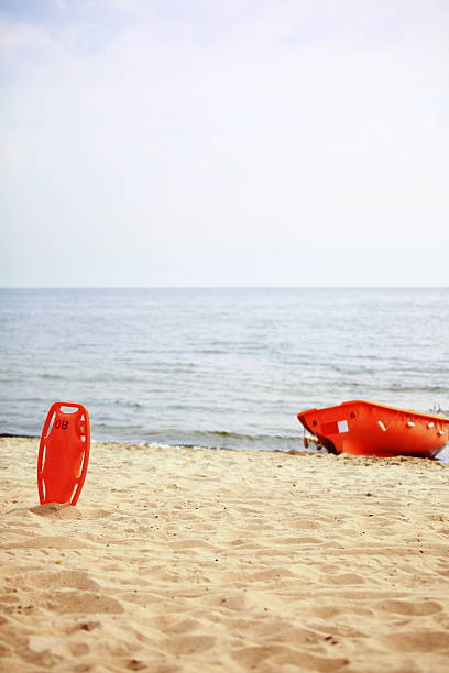 Beach life-saving. Lifeguard rescue equipment orange preserver tool...