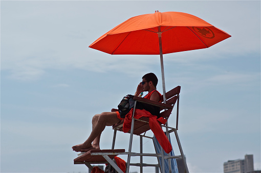 Coney Island, New York - May 30, 2011: View of the Lifeguard lookout tower on beach.