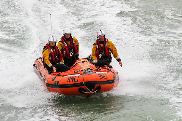 RNLI Lifeguards in action stock photo