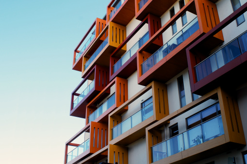 Balconies of a modern luxury apartments with a blue sky