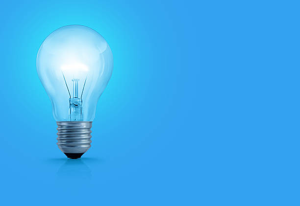 Light Bulb On Blue Background stock photo