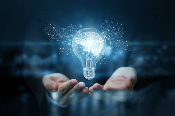 Light bulb with brain inside the hands of the businessman. Light bulb with brain inside the hands of the businessman. The concept of the business idea. intelligence stock pictures, royalty-free photos & images