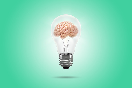 Bright light bulb with human brain