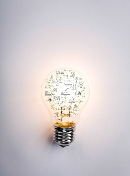 Light bulb with drawing graph stock photo