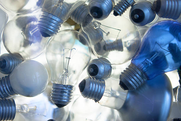 Light bulbs Lots of glass light bulbs halogen light stock pictures, royalty-free photos & images