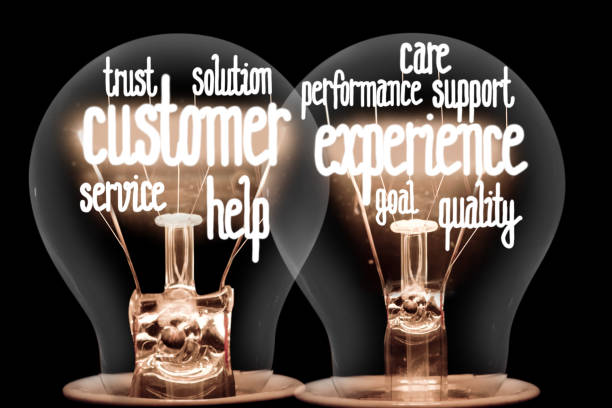 Light Bulbs with Customer Experience Concept stock photo