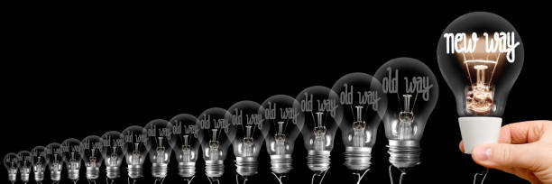 Light Bulbs with New and Old Way Concept stock photo